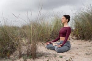 Senior woman meditating peacefully in a park